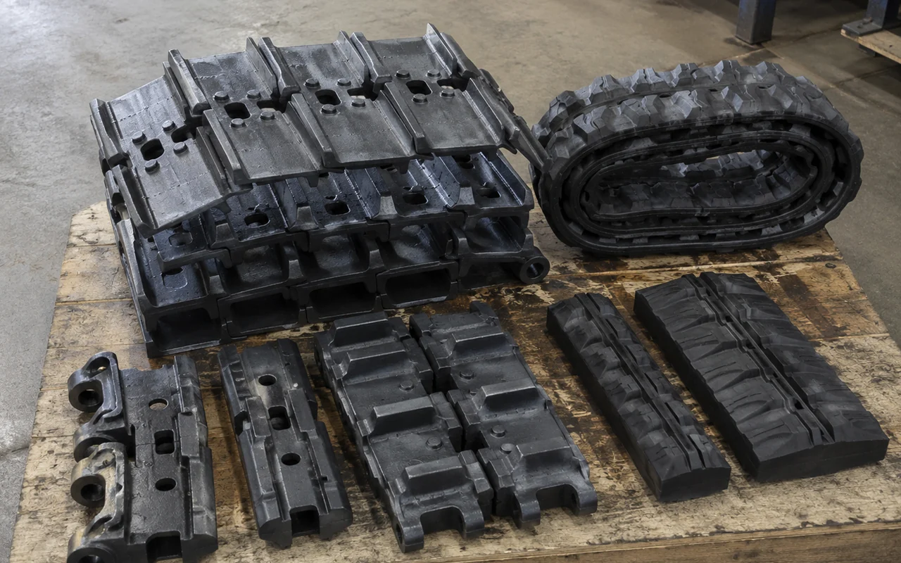 Track shoes and track pads arranged on a workshop pallet
