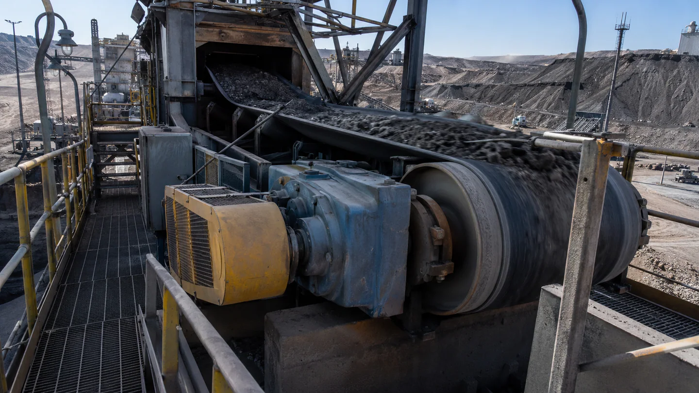 Conveyor pulley installed at a bulk-material handling drive station