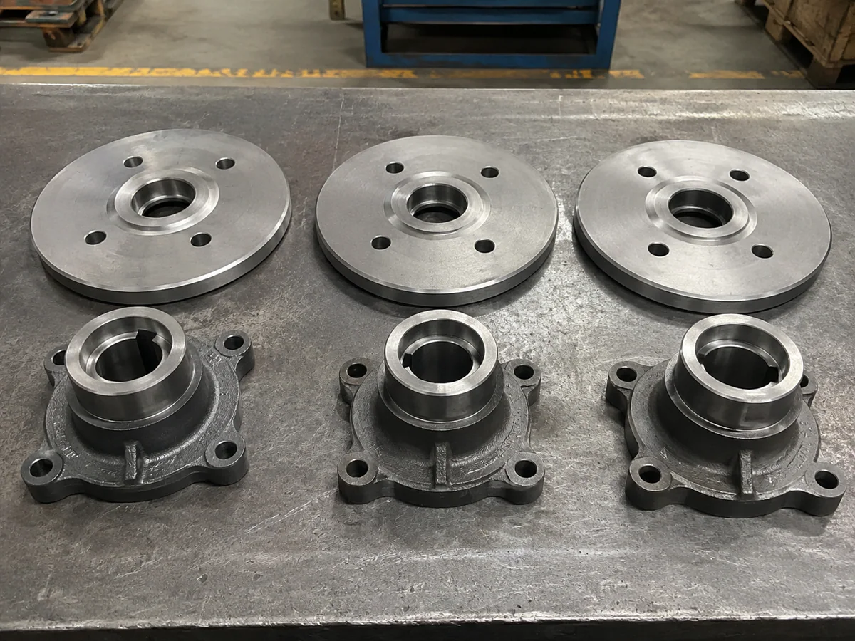 Conveyor pulley shaft, hub and end-disc components prepared for assembly