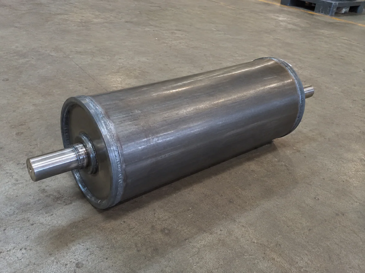 Steel conveyor tail pulley with welded end discs and shaft