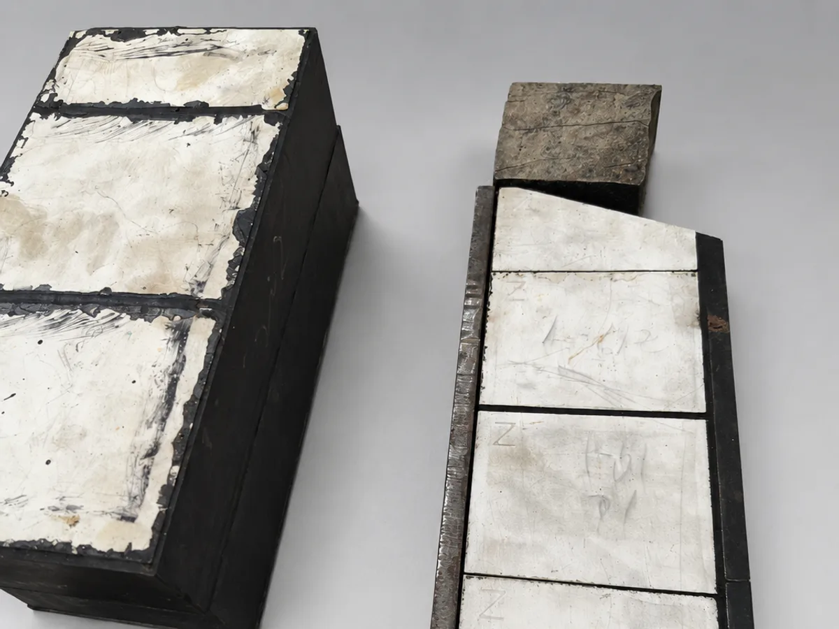Close view of ceramic wear liners bonded into fabricated steel forms