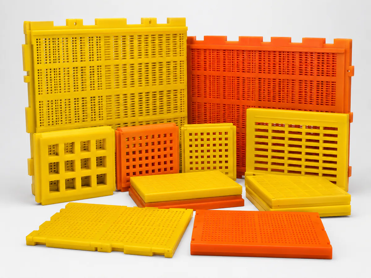 Yellow and orange polyurethane screen panels in multiple aperture patterns