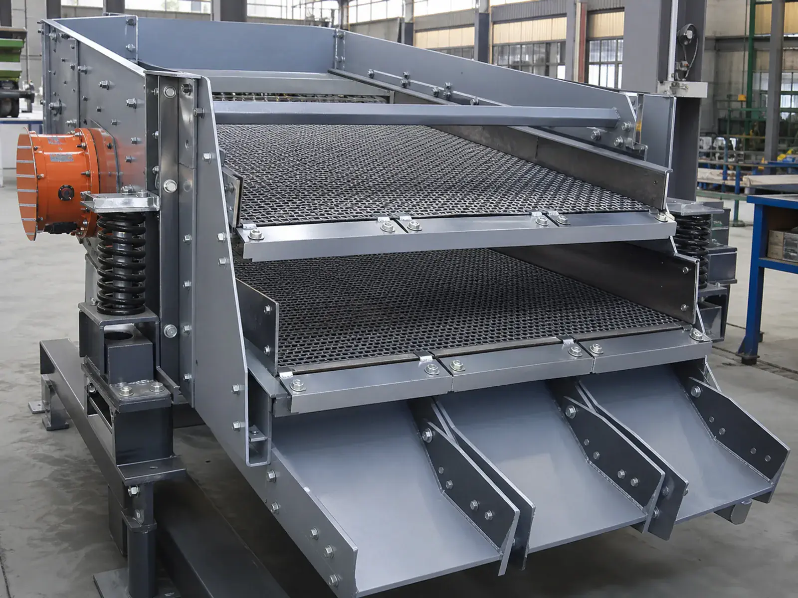 Two-deck screening machine with screen media interfaces and separated discharge chutes
