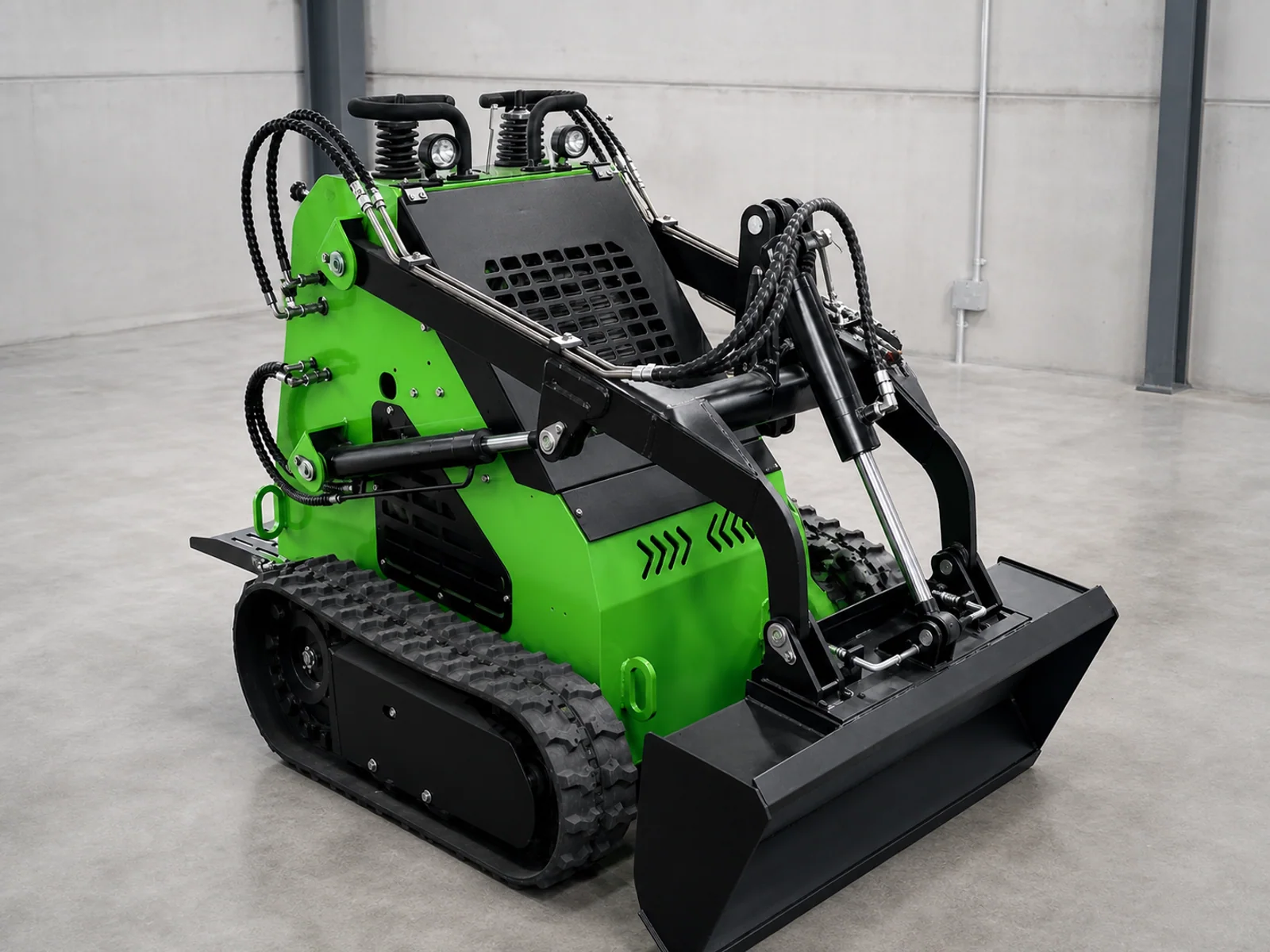 Green compact tracked skid steer loader shown as a reference configuration