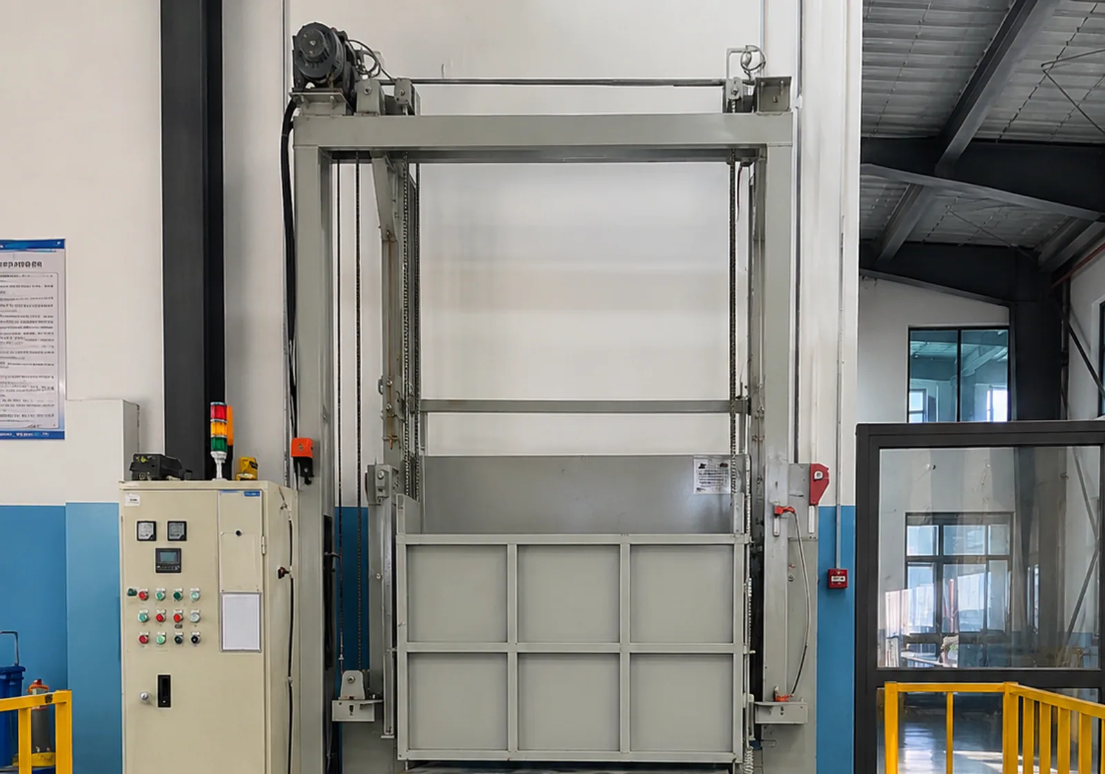 Rail-guided heat-treatment furnace and guarded loading area