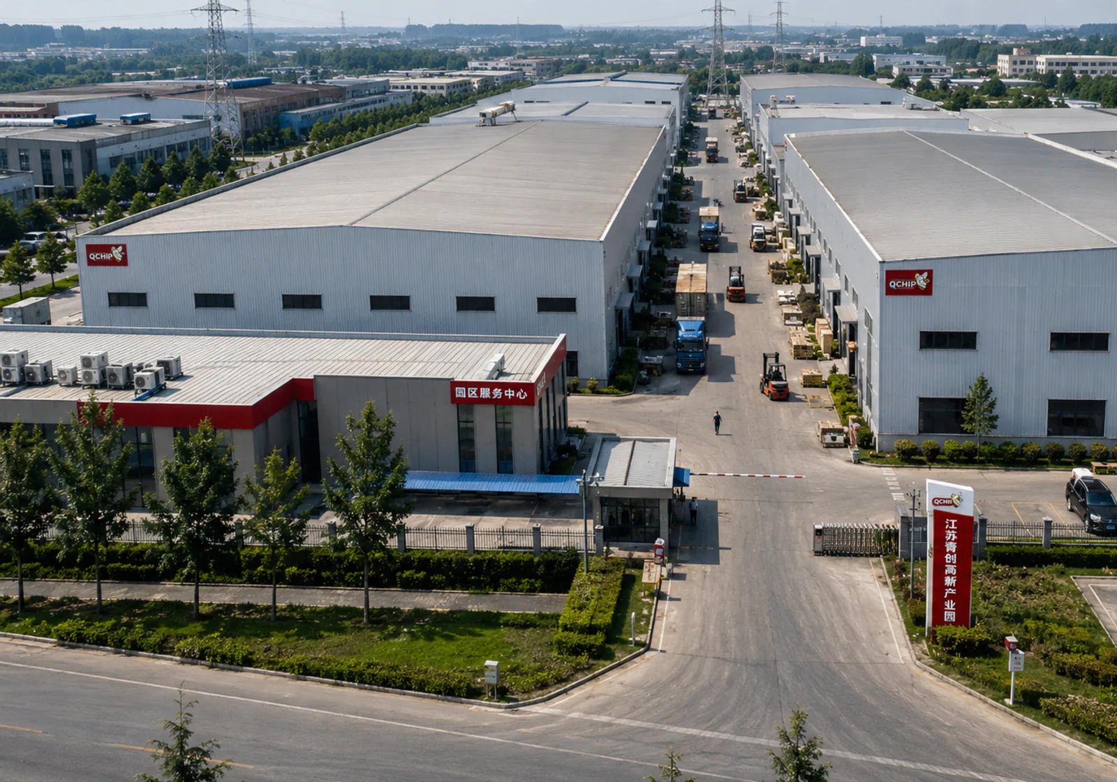 Aerial view of a manufacturing base entrance, workshop buildings and internal logistics area