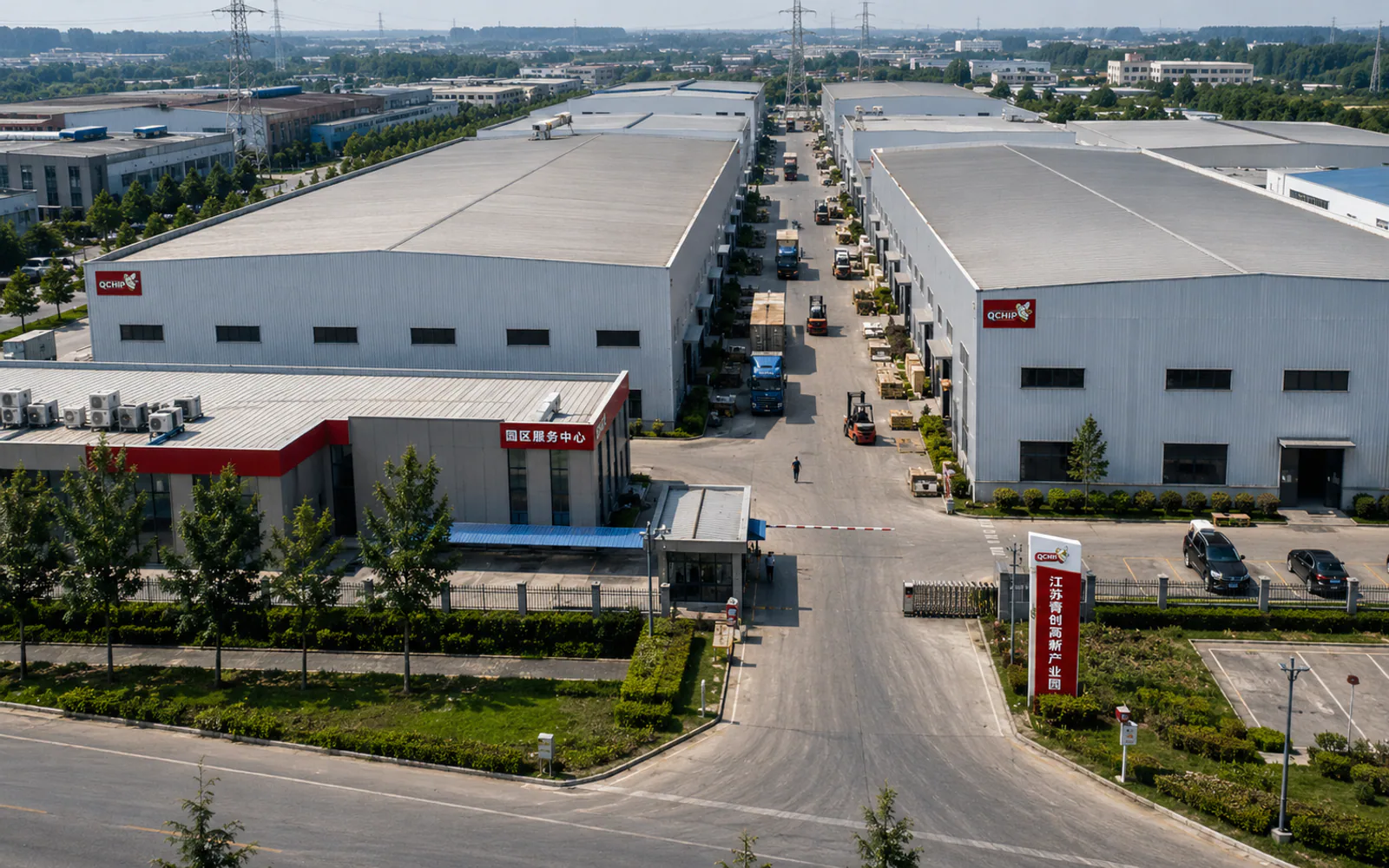 Aerial view of manufacturing workshops, an entrance and internal logistics access