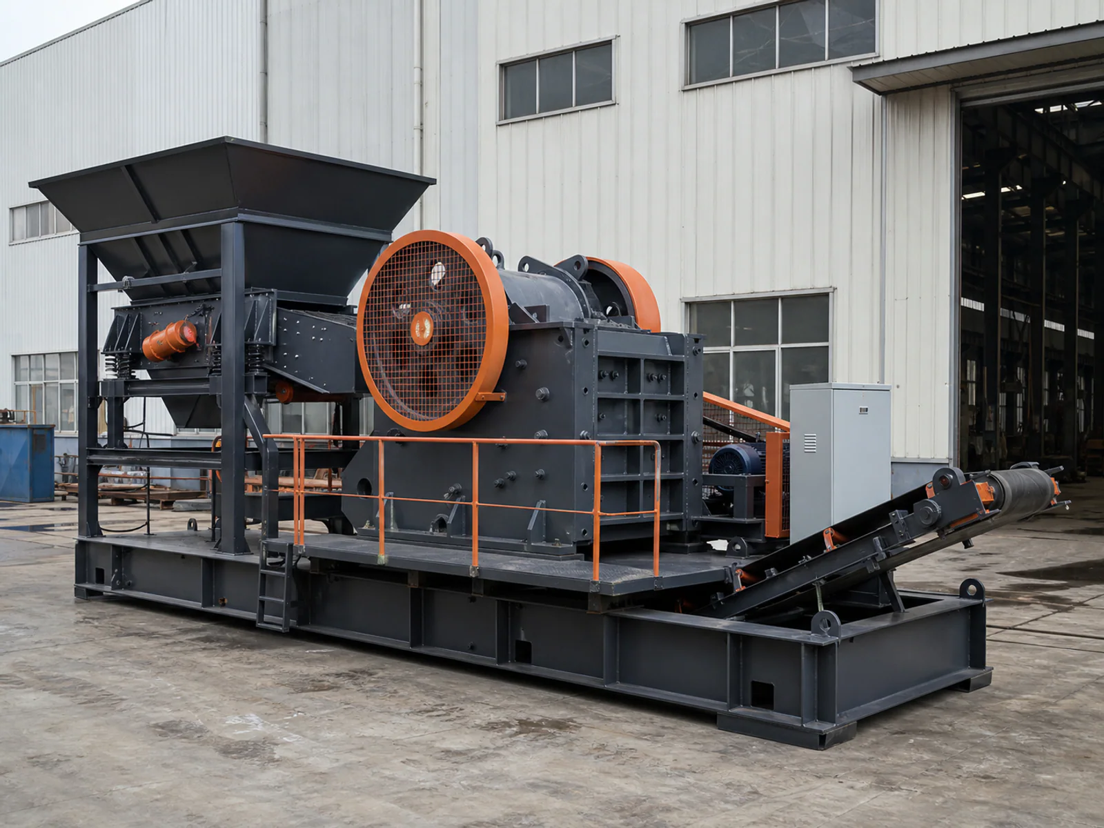 Compact jaw crusher mounted on a heavy skid frame with feed hopper and discharge conveyor